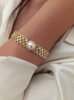 سوار بيسمارك مع حجر لولو في الوسط مطلي ذهب. MB-223