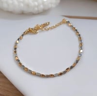 سوار بأحجار ناعمة لون فضي مع ذهبي مطلي ذهب. MB-170