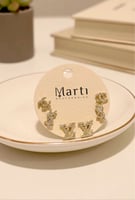 بيرسينج حروف مستوحاة من ماركات عالمية مغطاة بالزرك...