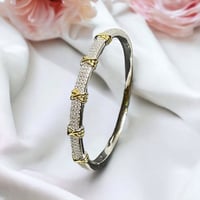 سوار تيتانيومى صلب بتصميم شكل XO لون فضي مع ذهبي M...