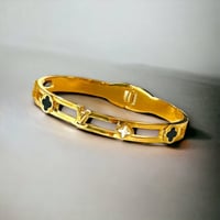 سوار تيتانيوم صلب لون ذهبي مع أحجار على شكل زهرة ب...