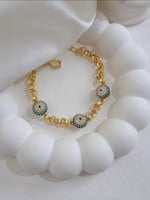 سوار مع كرات عين زرقاء مطلي ذهب. MB-098