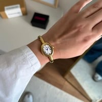 ساعة نسائية ستيل بلون ذهبي ميناء ابيض