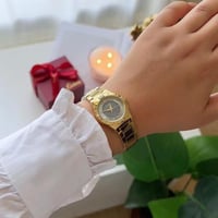 ساعة نسائية ستيل بلون ذهبي ميناء رمادي