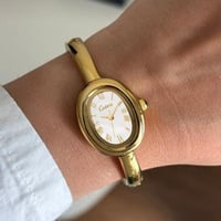 ساعة نسائية ستيل بلون ذهبي ميناء ابيض