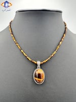 عقد وتعليقه حجر عين النمر الكريم الطبيعي .