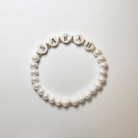 سوار اللؤلؤ الصدفي الطبيعي يتوسطها دوائر الصدف الخ...