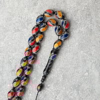 سبحه سوداء بنقشات كحلي واصفر واحمر