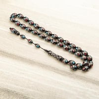 سبحه سوداء جميلة بنقاط حمراء وزرقاء