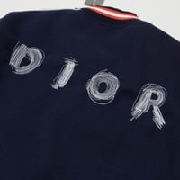 جاكيت ديور كحلي مع خطوط ابيض واحمر