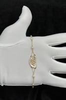 اسوارة شناف ذهب مع لؤلؤ عيار 18 وزن 2.15 جرام