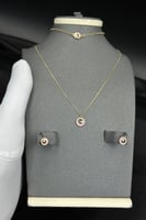 طقم اطفال دائري ذهب تصميم الماس عيار 18 وزن 4.9 جر...