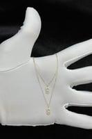 عقد دورين مستطيل ذهب تصميم الماس عيار 18 وزن من 0....