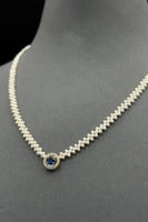 عقد لؤلؤ مع فص ملون مع ذهب عيار 18 وزن 0.8 جرام