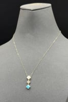 عقد وردتين لون فيروزي ذهب تصميم الماس عيار 18 وزن...