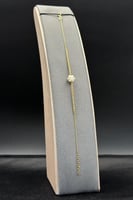 اسوارة مجدول ذهب مع لؤلؤ عيار 18 وزن 1.2 جرام