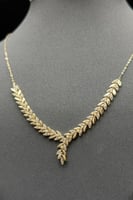 طقم اوراق الشجر ذهب تصميم الماس عيار 18 وزن 8.6 جر...