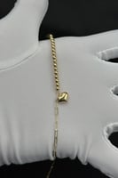 اسوارة كور مع قلب مع مستطيل ذهب صافي عيار 18 وزن 1...