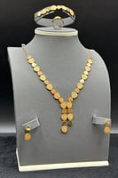 طقم ذهب صافي عيار 21 وزن 24.7 جرام