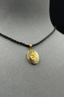 تعليقة عل شكل سبيكة بيضاوي ذهب ملون عيار 21 وزن 1....