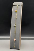 عقد مع اسوارة زهرة و قلب ذهب ملون عيار 18