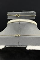 طقم مجدول دورين نازل ذهب صافي عيار 18 وزن 8.1 جرام