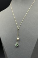 عقد وردة مع لؤلؤ ذهب مع صدف ملون عيار 18 وزن من 1....