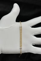 اسوارة شوطين مجدول لونين ذهب صافي عيار 18 وزن من 1...