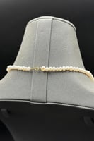 عقد ذهب مع لؤلؤ مع فص اخضر عيار 18 وزن 1.3 جرام