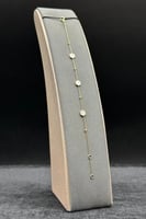 اسوارة خلية ذهب مع صدف ابيض عيار 18 وزن من 1.4 الى...