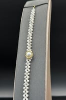 اسوارة لؤلؤ كور عريضة مع ذهب عيار18 وزن 0.7جرام