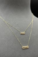 عقد دورين مستطيل ذهب تصميم الماس عيار 18 وزن من 0....