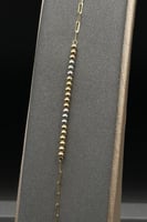 اسوارة ذهب عيار 18 صافي بتصميم كور ملونة بوزن 0.8...