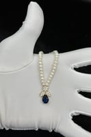 عقد ذهب مع لؤلؤ مع فص ازرق عيار 18 وزن 1.3 جرام