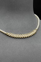 عقد ذهب مع لؤلؤ عيار 18 وزن 2 جرام