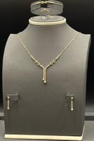 طقم تنس مع كور ذهب تصميم الماس