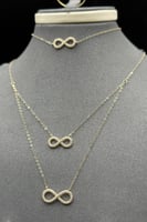 طقم دورين انفنتي ذهب تصميم الماس عيار 18 وزن 2.5 ج...