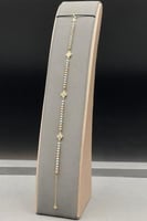 اسوارة ذهب عيار 18 وردات مع كور ذهب ملونه وزن 1.3...