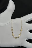 عقد خمسة وردات ذهب صافي عيار 18 وزن من 1.1 الى 1.2...