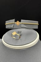 طقم مجدول مع وردة ذهب صافي عيار 21 وزن من 2.1 الى...