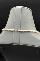 عقد ذهب مع لؤلؤ مع فص ازرق عيار 18 وزن 1.3 جرام