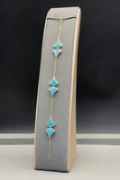 اسوارة معينات ذهب مع صدف فيروزي عيار 18 وزن 7.7 جر...