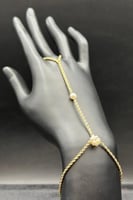 كف مجدول ذهب مع لؤلؤ عيار 18 وزن من 2.1 الى 2.2 جر...