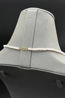 عقد لؤلؤ مع ذهب بالمنتصف عيار 18 وزن 1.1 جرام