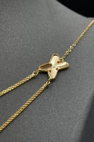 طقم شكل X ذهب صافي عيار 21