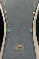 شال وردة ذهب مع صدف فيروزي عيار 18 وزن 1.7 جرام