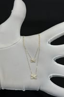 عقد شكل X دورين ذهب تصميم الماس عيار 18 وزن من 0.8...