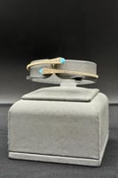 اسوارة ذهب مع فص سماوي عيار 18 وزن 7.8 جرام