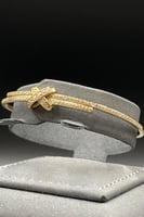 اسوارة مع خاتم شكل اكس ذهب تصميم الماس