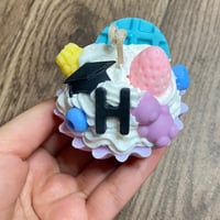 شمعة الكب كيك بثيم التخرج